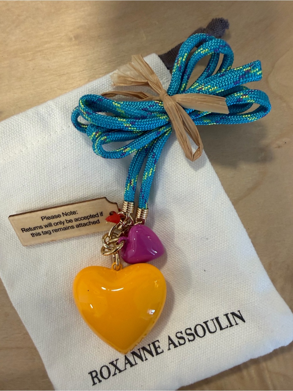 Roxanne Assoulin Turquoise Cord Necklace with Yellow and Pink Heart Charms - Picture 2 of 4